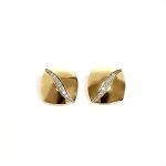 Measurements 16mm x 16mm. And 19mm corner to corner Handmade 18ct yellow gold curved cushion-shaped clip-on earrings with an 18ct white gold wave going from corner to corner set with seven graduated round white diamonds to each earring.