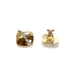 Measurements 16mm x 16mm. And 19mm corner to corner Handmade 18ct yellow gold curved cushion-shaped clip-on earrings with an 18ct white gold wave going from corner to corner set with seven graduated round white diamonds to each earring.