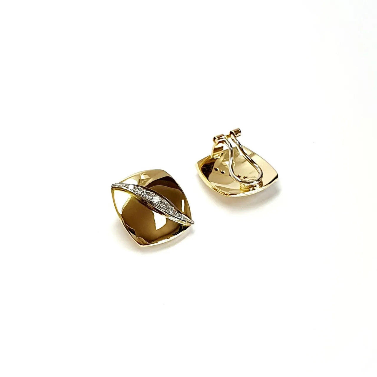 Measurements 16mm x 16mm. And 19mm corner to corner Handmade 18ct yellow gold curved cushion-shaped clip-on earrings with an 18ct white gold wave going from corner to corner set with seven graduated round white diamonds to each earring.