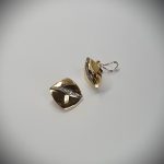 Measurements 16mm x 16mm. And 19mm corner to corner Handmade 18ct yellow gold curved cushion-shaped clip-on earrings with an 18ct white gold wave going from corner to corner set with seven graduated round white diamonds to each earring.