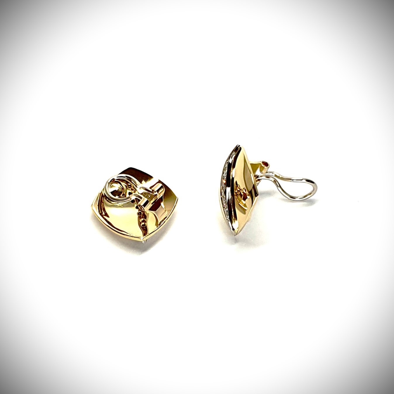Measurements 16mm x 16mm. And 19mm corner to corner Handmade 18ct yellow gold curved cushion-shaped clip-on earrings with an 18ct white gold wave going from corner to corner set with seven graduated round white diamonds to each earring.