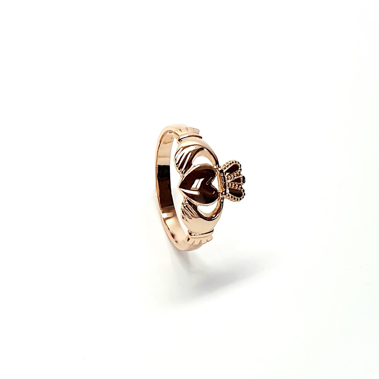 A 9ct rose gold Claddagh ring (Irish fáinne Chladaigh) is a traditional Irish ring in which a heart represents love, the crown stands for loyalty, and two clasped hands symbolize friendship.
