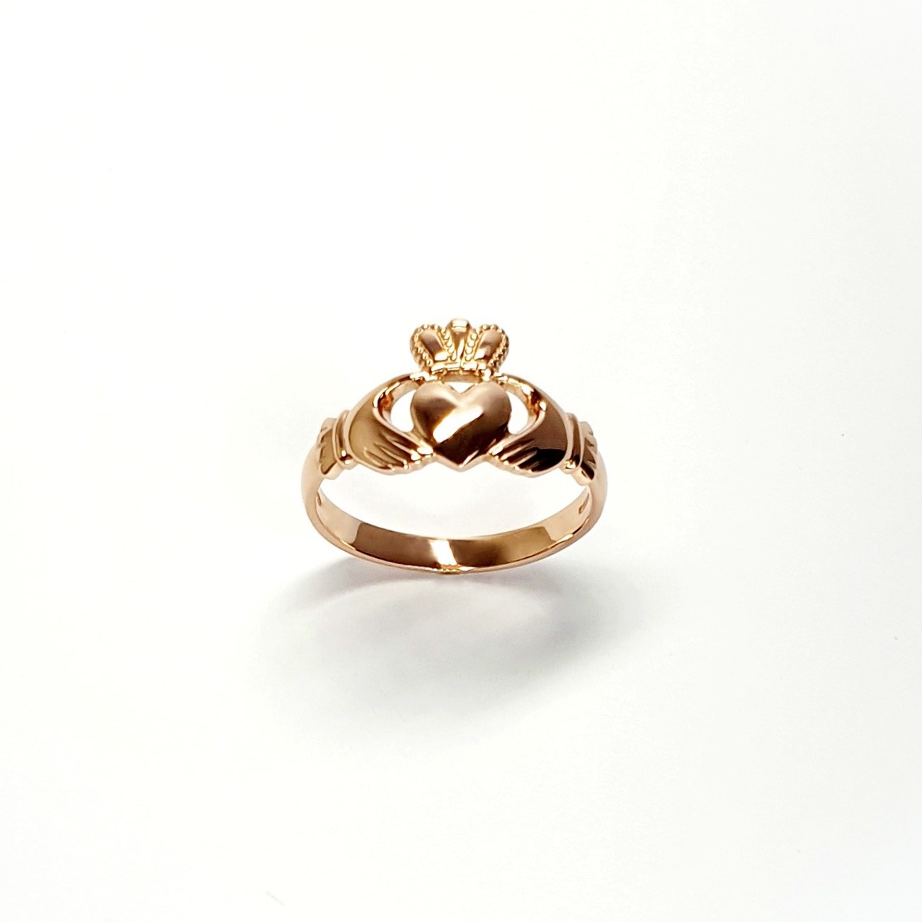 A 9ct rose gold Claddagh ring (Irish fáinne Chladaigh) is a traditional Irish ring in which a heart represents love, the crown stands for loyalty, and two clasped hands symbolize friendship.