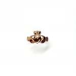 A 9ct rose gold Claddagh ring (Irish fáinne Chladaigh) is a traditional Irish ring in which a heart represents love, the crown stands for loyalty, and two clasped hands symbolize friendship.