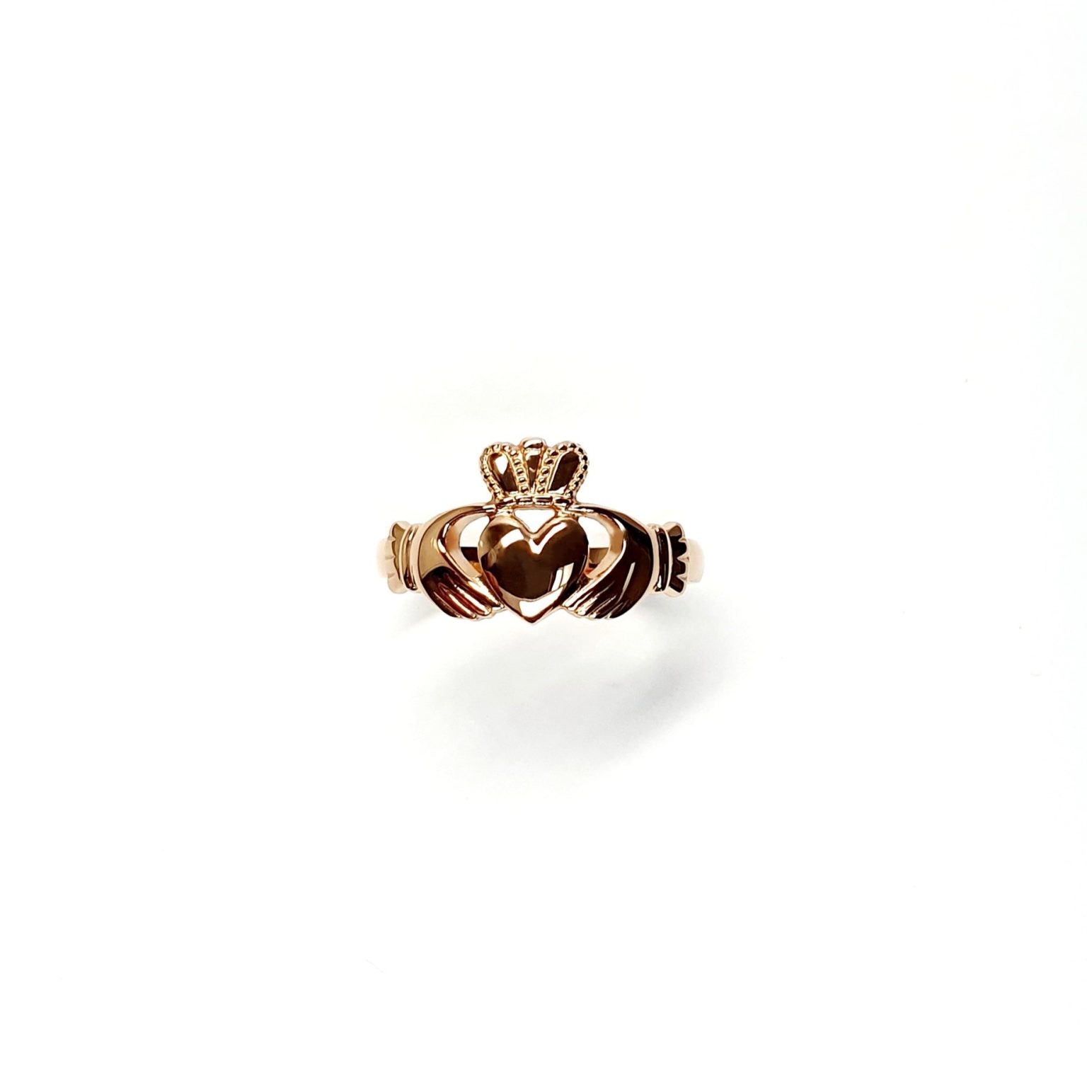 A 9ct rose gold Claddagh ring (Irish fáinne Chladaigh) is a traditional Irish ring in which a heart represents love, the crown stands for loyalty, and two clasped hands symbolize friendship.