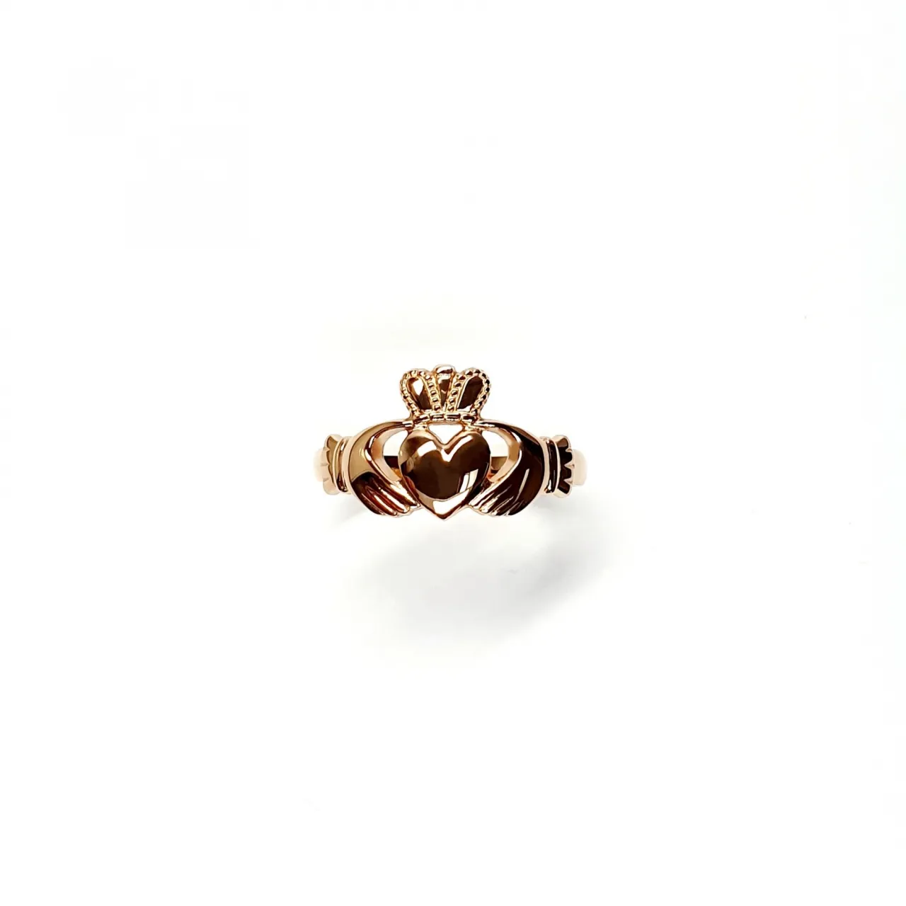 A 9ct rose gold Claddagh ring (Irish fáinne Chladaigh) is a traditional Irish ring in which a heart represents love, the crown stands for loyalty, and two clasped hands symbolize friendship.
