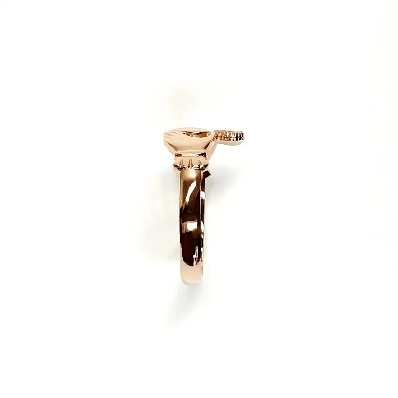 A 9ct rose gold Claddagh ring (Irish fáinne Chladaigh) is a traditional Irish ring in which a heart represents love, the crown stands for loyalty, and two clasped hands symbolize friendship.
