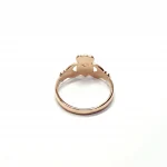 A 9ct rose gold Claddagh ring (Irish fáinne Chladaigh) is a traditional Irish ring in which a heart represents love, the crown stands for loyalty, and two clasped hands symbolize friendship.