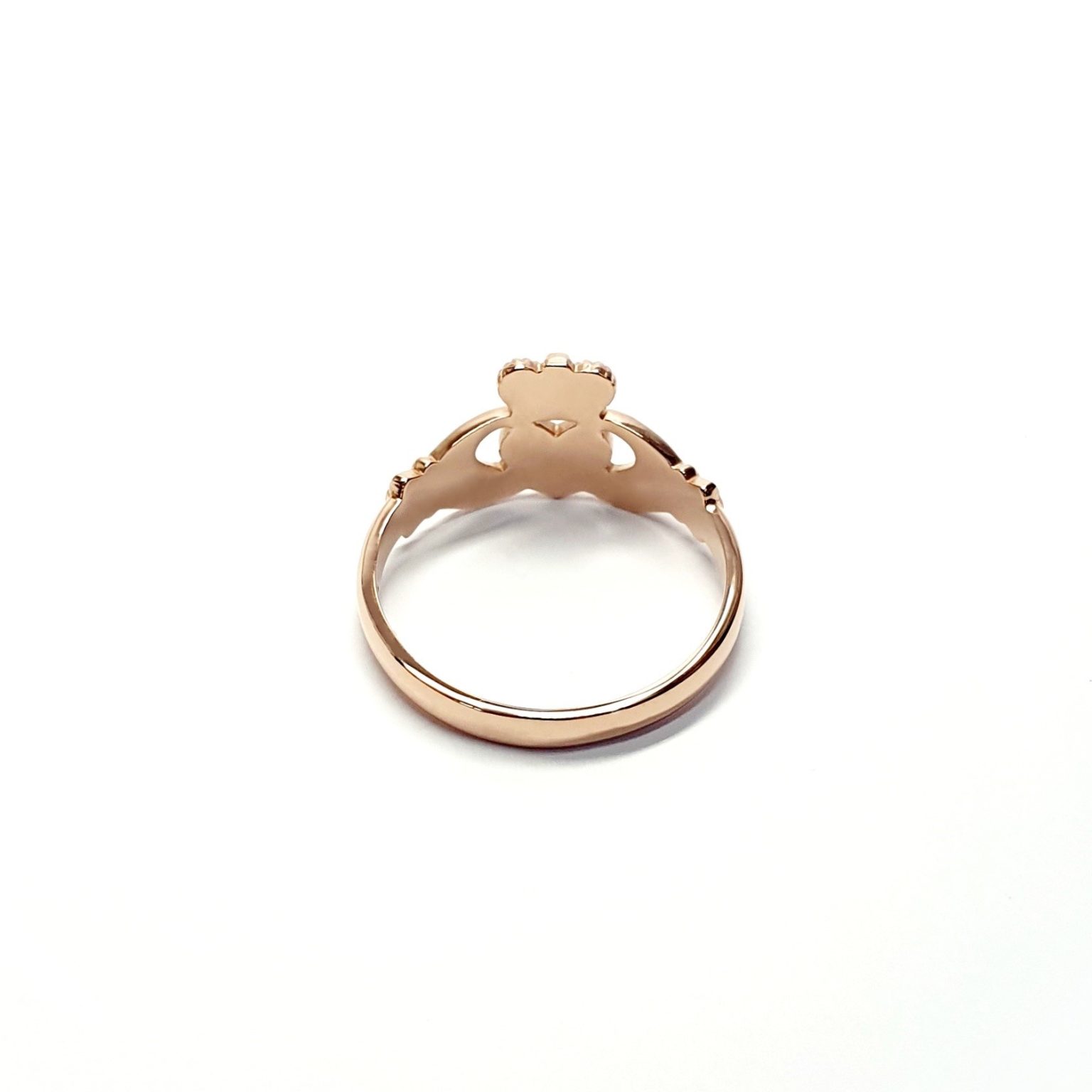 A 9ct rose gold Claddagh ring (Irish fáinne Chladaigh) is a traditional Irish ring in which a heart represents love, the crown stands for loyalty, and two clasped hands symbolize friendship.