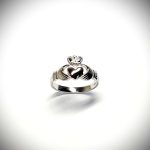 A 9ct white gold Claddagh ring (Irish fáinne Chladaigh) is a traditional Irish ring in which a heart represents love, the crown stands for loyalty, and two clasped hands symbolize friendship.