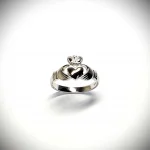 A 9ct white gold Claddagh ring (Irish fáinne Chladaigh) is a traditional Irish ring in which a heart represents love, the crown stands for loyalty, and two clasped hands symbolize friendship.