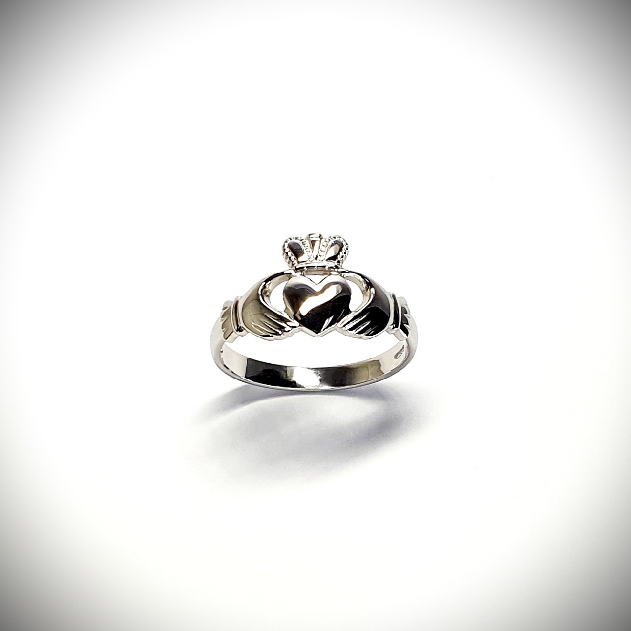 A 9ct white gold Claddagh ring (Irish fáinne Chladaigh) is a traditional Irish ring in which a heart represents love, the crown stands for loyalty, and two clasped hands symbolize friendship.