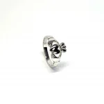 A 9ct white gold Claddagh ring (Irish fáinne Chladaigh) is a traditional Irish ring in which a heart represents love, the crown stands for loyalty, and two clasped hands symbolize friendship.