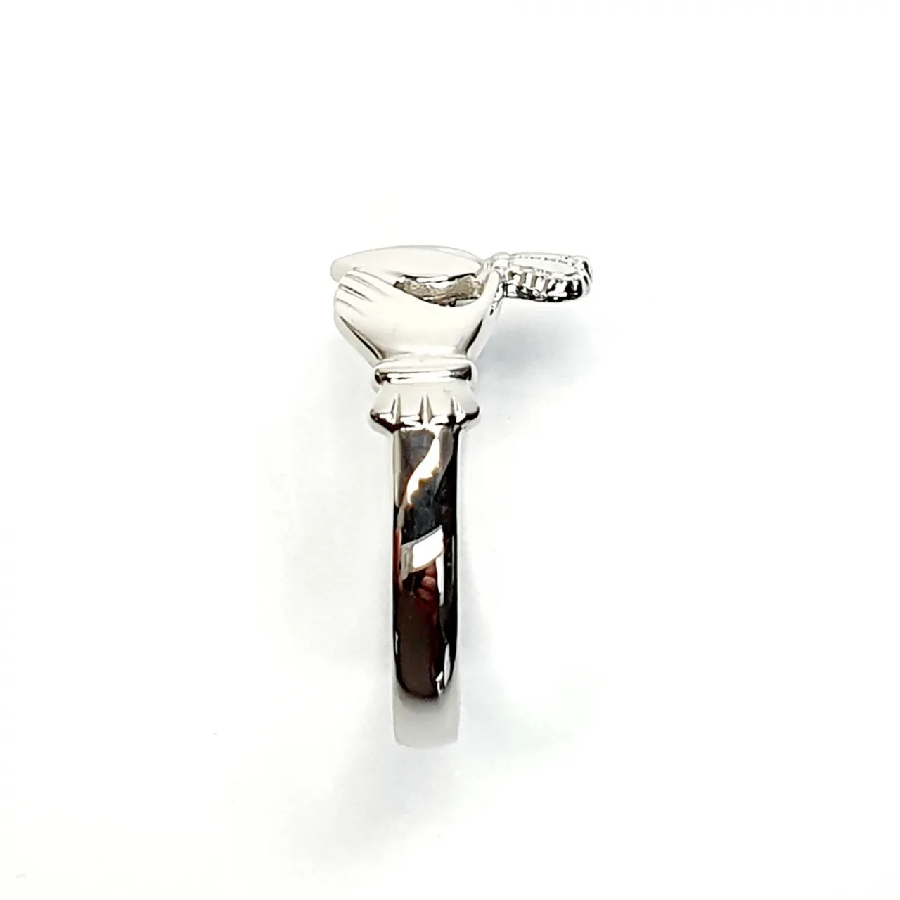 A 9ct white gold Claddagh ring (Irish fáinne Chladaigh) is a traditional Irish ring in which a heart represents love, the crown stands for loyalty, and two clasped hands symbolize friendship.