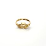A 9ct yellow gold Claddagh ring (Irish fáinne Chladaigh) is a traditional Irish ring in which a heart represents love, the crown stands for loyalty, and two clasped hands symbolize friendship.