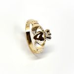 A 9ct yellow gold Claddagh ring (Irish fáinne Chladaigh) is a traditional Irish ring in which a heart represents love, the crown stands for loyalty, and two clasped hands symbolize friendship.