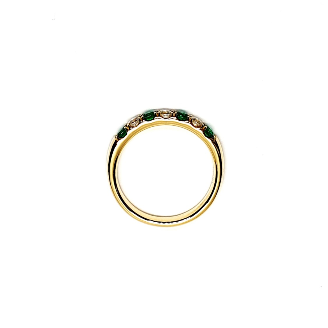 18ct yellow gold seven-stone eternity ring 3.5mm wide set with four 2.8mm round emeralds and three 2.8mm round diamonds in four claw settings