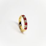 18ct yellow gold ruby and diamond half eternity ring set with three round white diamonds and four round blood red rubies, a solid tactile ring with rounded edges
