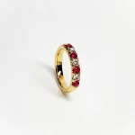 18ct yellow gold ruby and diamond half eternity ring set with three round white diamonds and four round blood red rubies, a solid tactile ring with rounded edges