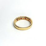 18ct yellow gold ruby and diamond half eternity ring set with three round white diamonds and four round blood red rubies, a solid tactile ring with rounded edges
