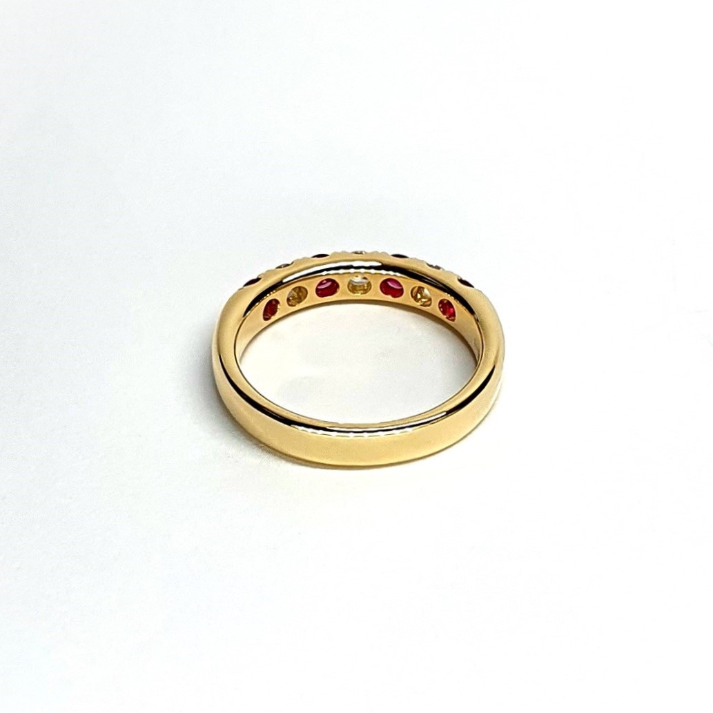 18ct yellow gold ruby and diamond half eternity ring set with three round white diamonds and four round blood red rubies, a solid tactile ring with rounded edges