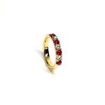 18ct yellow gold ruby and diamond half eternity ring set with three round white diamonds and four round blood red rubies, a solid tactile ring with rounded edges