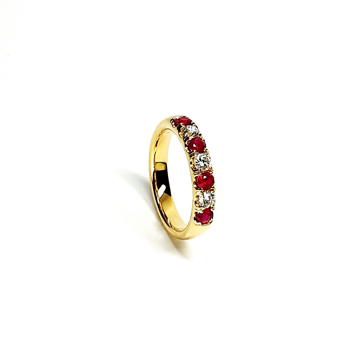 18ct yellow gold ruby and diamond half eternity ring set with three round white diamonds and four round blood red rubies, a solid tactile ring with rounded edges