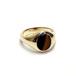 The City of London Jewellers presents the Eyemouth heavy 9ct yellow gold 12mm x 10mm oval Tigers Eye with a slightly curved top rub-over set into a plain polished signet ring, angled view laying down from the front facing right.