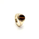 The City of London Jewellers presents the Eyemouth heavy 9ct yellow gold 12mm x 10mm oval Tigers Eye with a slightly curved top rub-over set into a plain polished signet ring, angled view