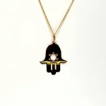 This Hamsa Pendant/necklace incorporates a cut-out design of a Star of David of filigree style with a diamond cut pattern for extra sparkle. Back view.