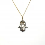 This Hamsa Pendant/necklace incorporates a cut-out design of a Star of David of filigree style with a diamond cut pattern for extra sparkle.