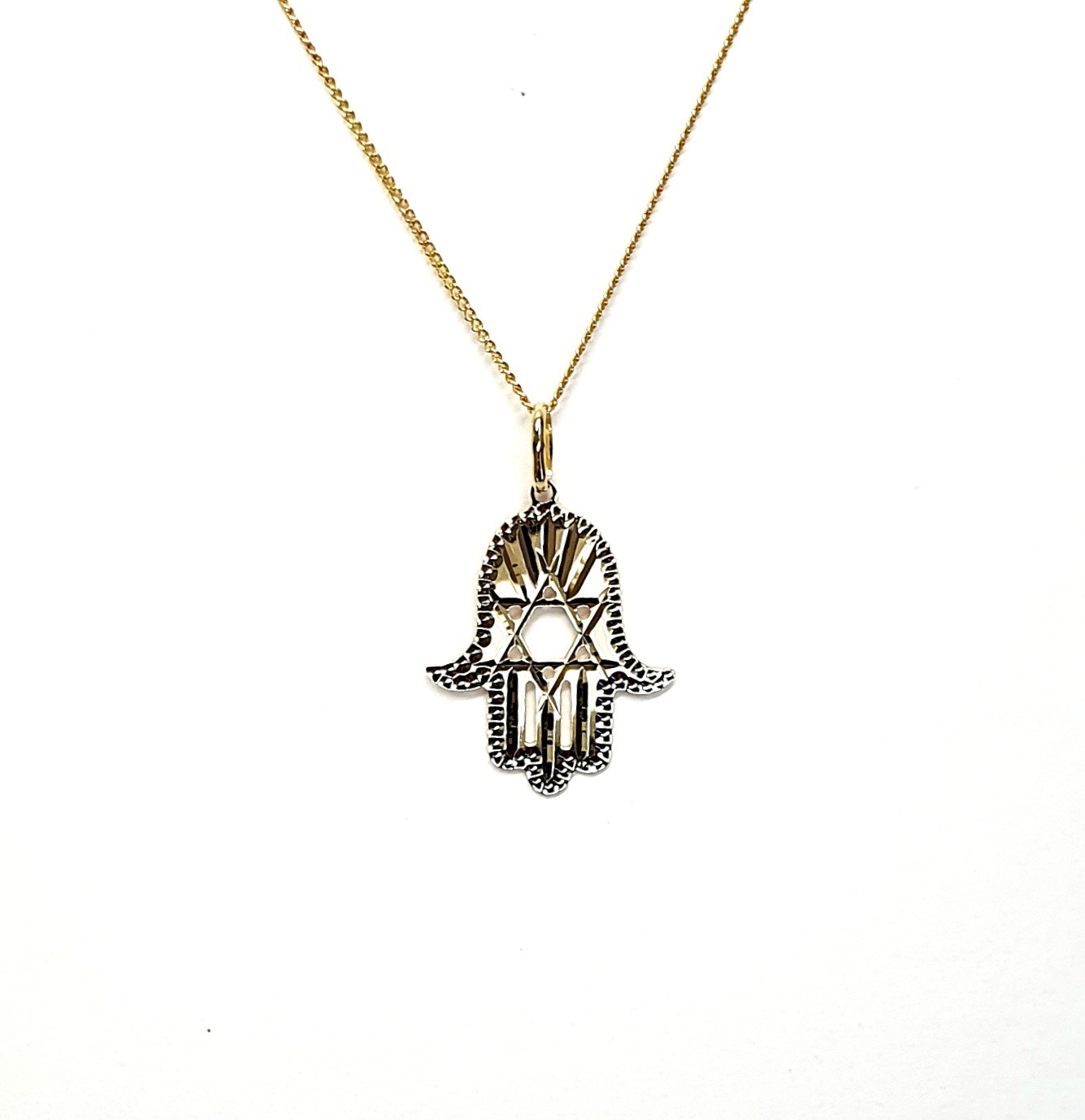 This Hamsa Pendant/necklace incorporates a cut-out design of a Star of David of filigree style with a diamond cut pattern for extra sparkle.