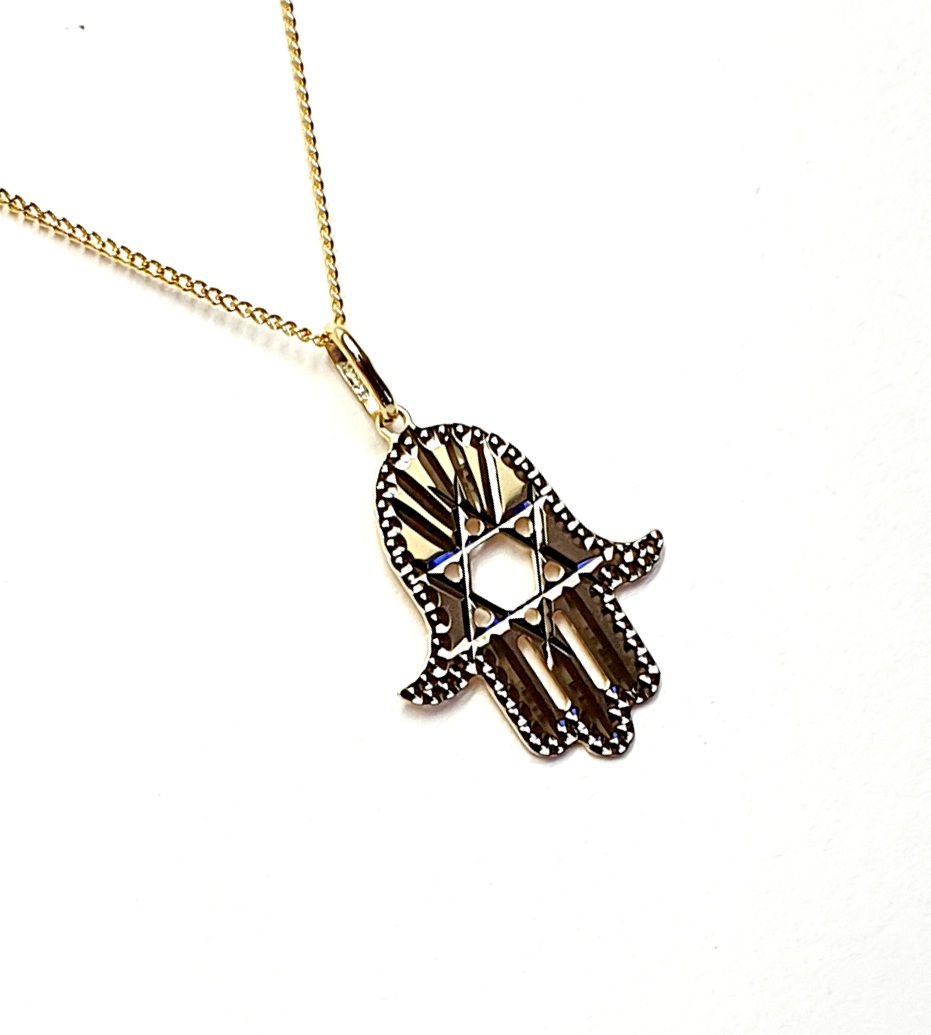 This Hamsa Pendant/necklace incorporates a cut-out design of a Star of David of filigree style with a diamond cut pattern for extra sparkle.