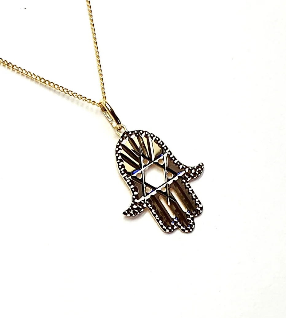 This Hamsa Pendant/necklace incorporates a cut-out design of a Star of David of filigree style with a diamond cut pattern for extra sparkle.