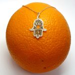 This Hamsa Pendant/necklace incorporates a cut-out design of a Star of David of filigree style with a diamond cut pattern for extra sparkle.