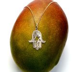 This Hamsa Pendant/necklace incorporates a cut-out design of a Star of David of filigree style with a diamond cut pattern for extra sparkle.
