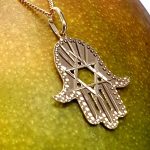 This Hamsa Pendant/necklace incorporates a cut-out design of a Star of David of filigree style with a diamond cut pattern for extra sparkle.