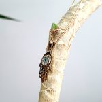 9ct yellow gold filigree style evil eye hamsa pendant and chain/necklace pendant height, including saddle bail 23.6mm width 12.5mm evil-eye set with a single black CZ pupil surrounded with six blue CZs and twelve white CZs.