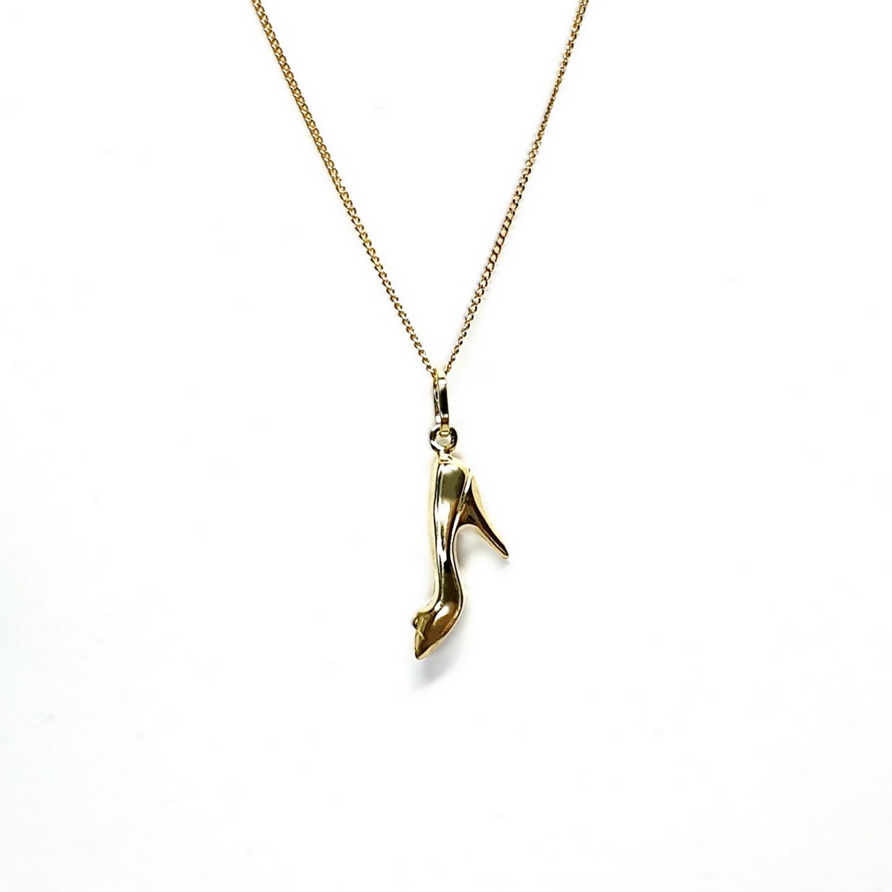 Ordsall 9ct Gold Shoe Necklace CMP00296: A refined 9ct gold pendant and chain delicately crafted in the shape of a high heel. Lightweight and versatile, perfect for everyday elegance.