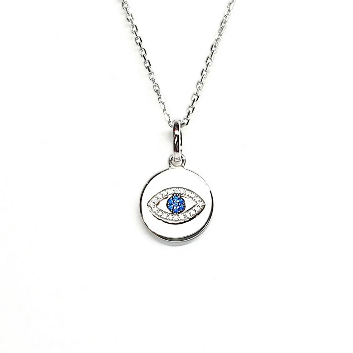 A round disc silver evil eye necklace/pendant made in real sterling silver with sparkling blue & white cubic zirconia with a highly polished finish.