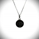A round disc silver evil eye necklace/pendant made in real sterling silver with sparkling blue & white cubic zirconia with a highly polished finish view of the back.