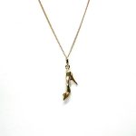 Ordsall 9ct Gold Shoe Necklace CMP00296: A refined 9ct gold pendant and chain delicately crafted in the shape of a high heel. Lightweight and versatile, perfect for everyday elegance.