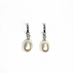 18ct white gold polished huggie loop/hoop earrings leading to a single round diamond and then onto  a single oval pearl drop.