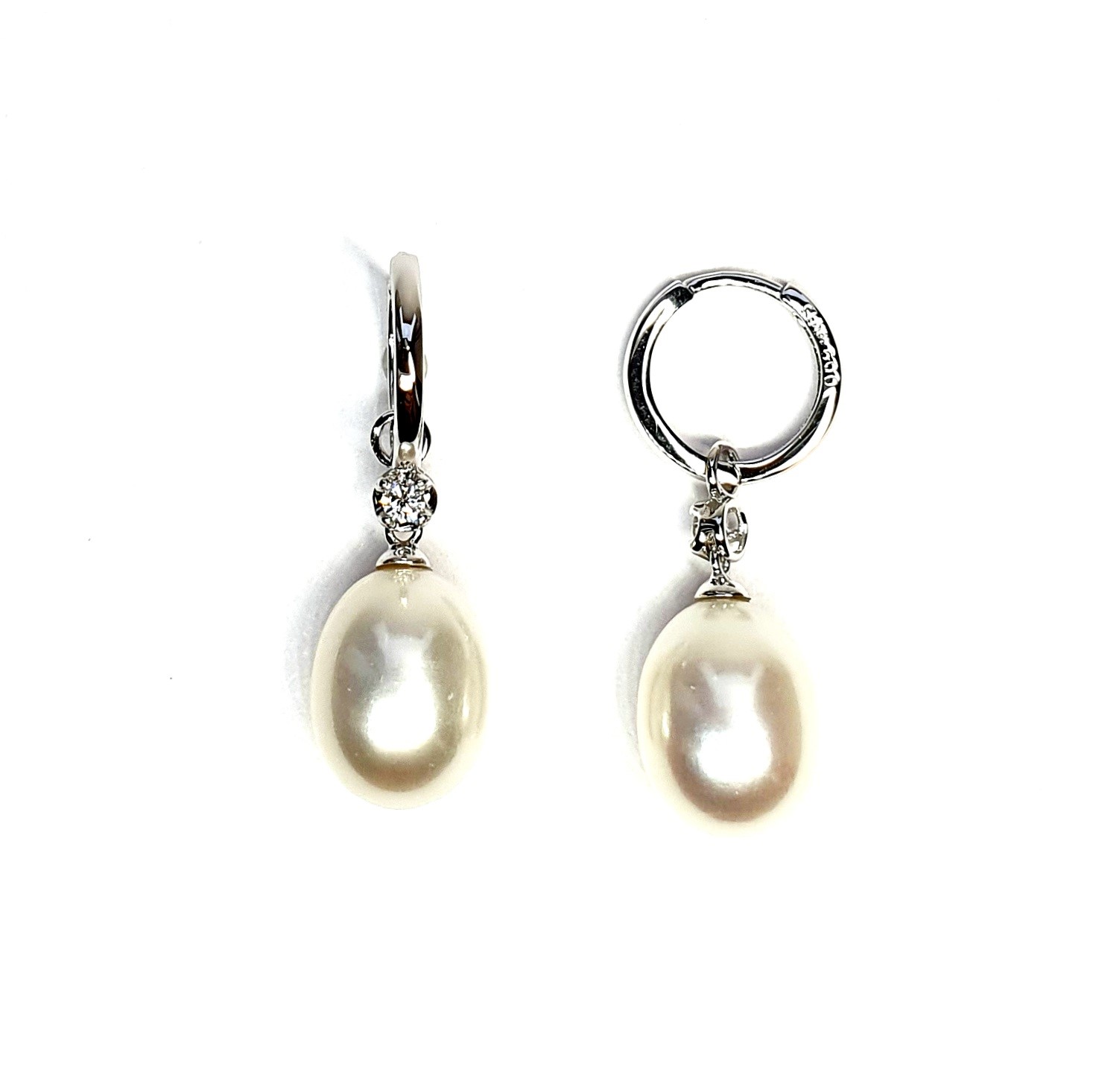 18ct white gold polished huggie loop/hoop earrings leading to a single round diamond and then onto  a single oval pearl drop.