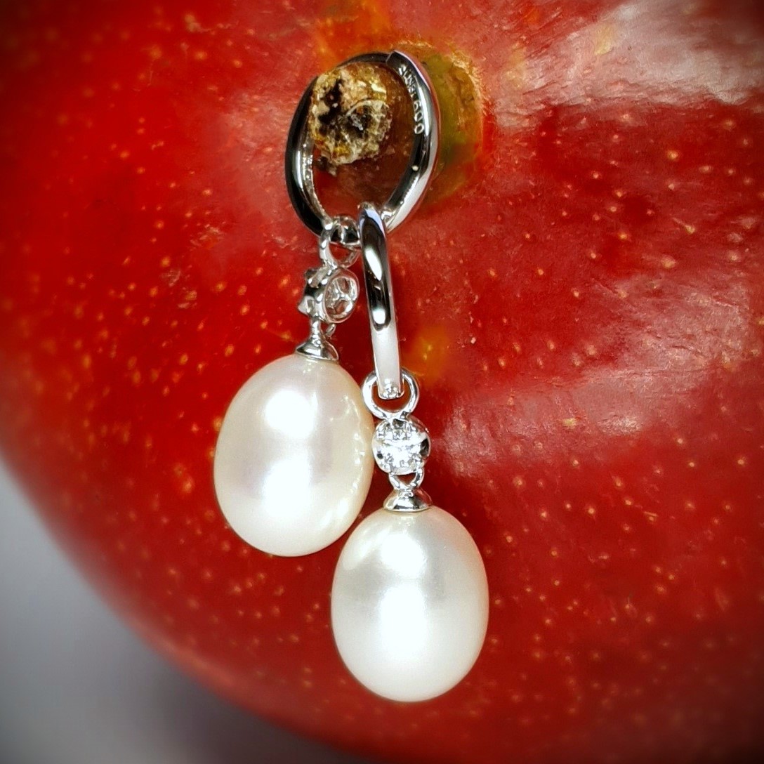 18ct white gold polished huggie loop/hoop earrings leading to a single round diamond and then onto  a single oval pearl drop.