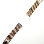 9ct yellow gold watch bracelet GWQ00018  handmade in the United Kingdom, each solid link has been carefully put together and soldered by hand with thick gold pins, and the sturdy gold clasp has a gorgeous engine-turned pattern with a plain cartouche suitable for engraving if you so wish.