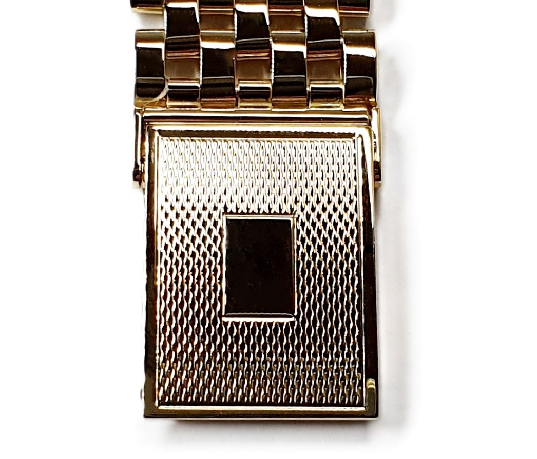 9ct yellow gold watch bracelet GWQ00018  handmade in the United Kingdom, each solid link has been carefully put together and soldered by hand with thick gold pins, and the sturdy gold clasp has a gorgeous engine-turned pattern with a plain cartouche suitable for engraving if you so wish.