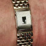 9ct yellow gold watch bracelet GWQ00018  handmade in the United Kingdom, each solid link has been carefully put together and soldered by hand with thick gold pins, and the sturdy gold clasp has a gorgeous engine-turned pattern with a plain cartouche suitable for engraving if you so wish.