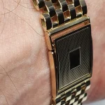 9ct yellow gold watch bracelet GWQ00018  handmade in the United Kingdom, each solid link has been carefully put together and soldered by hand with thick gold pins, and the sturdy gold clasp has a gorgeous engine-turned pattern with a plain cartouche suitable for engraving if you so wish.