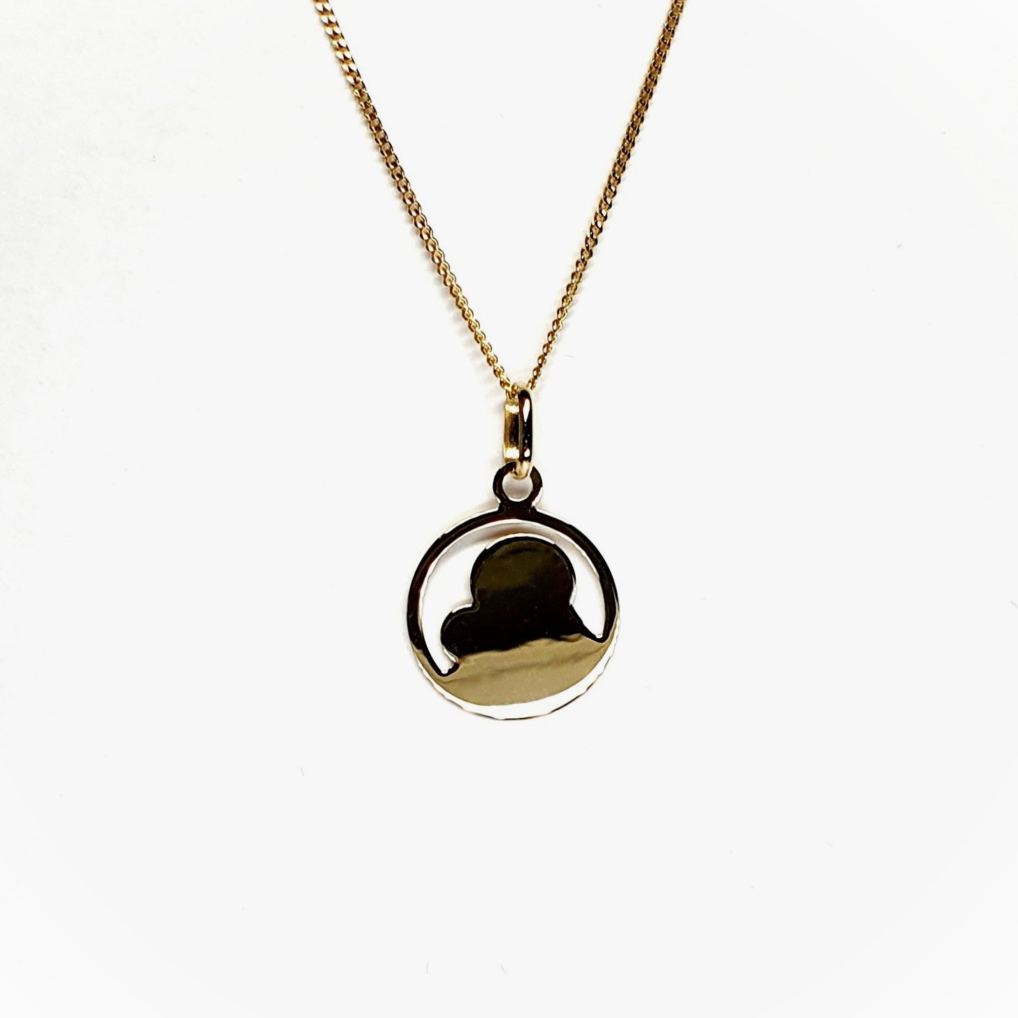 9ct yellow gold Mary and Child pendant and chain necklace PC00371 with a laser engraved detail, view of the back.